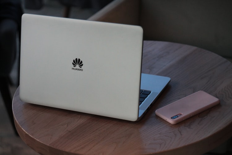 A laptop by Huawei with logo
