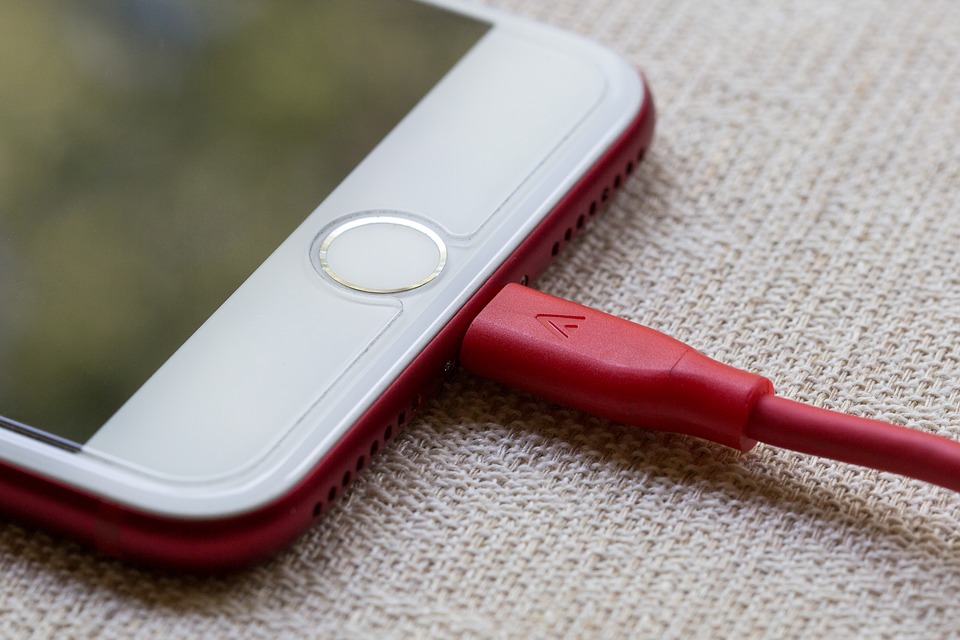 A red iPhone charging